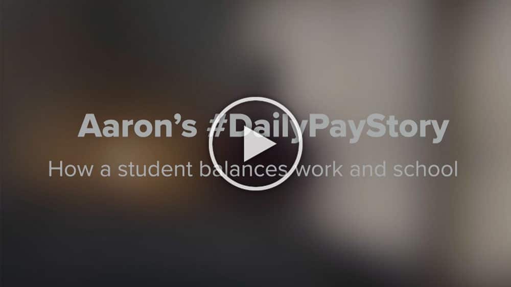 Thumbnail of a video titled "Aaron's #DailyPayStory" with the subtitle "How a student balances work and school," featuring a play button in the center.